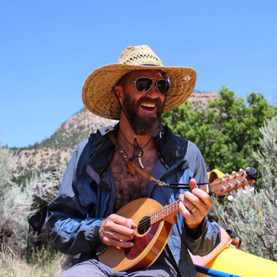 musician during rafting trip in new mexico