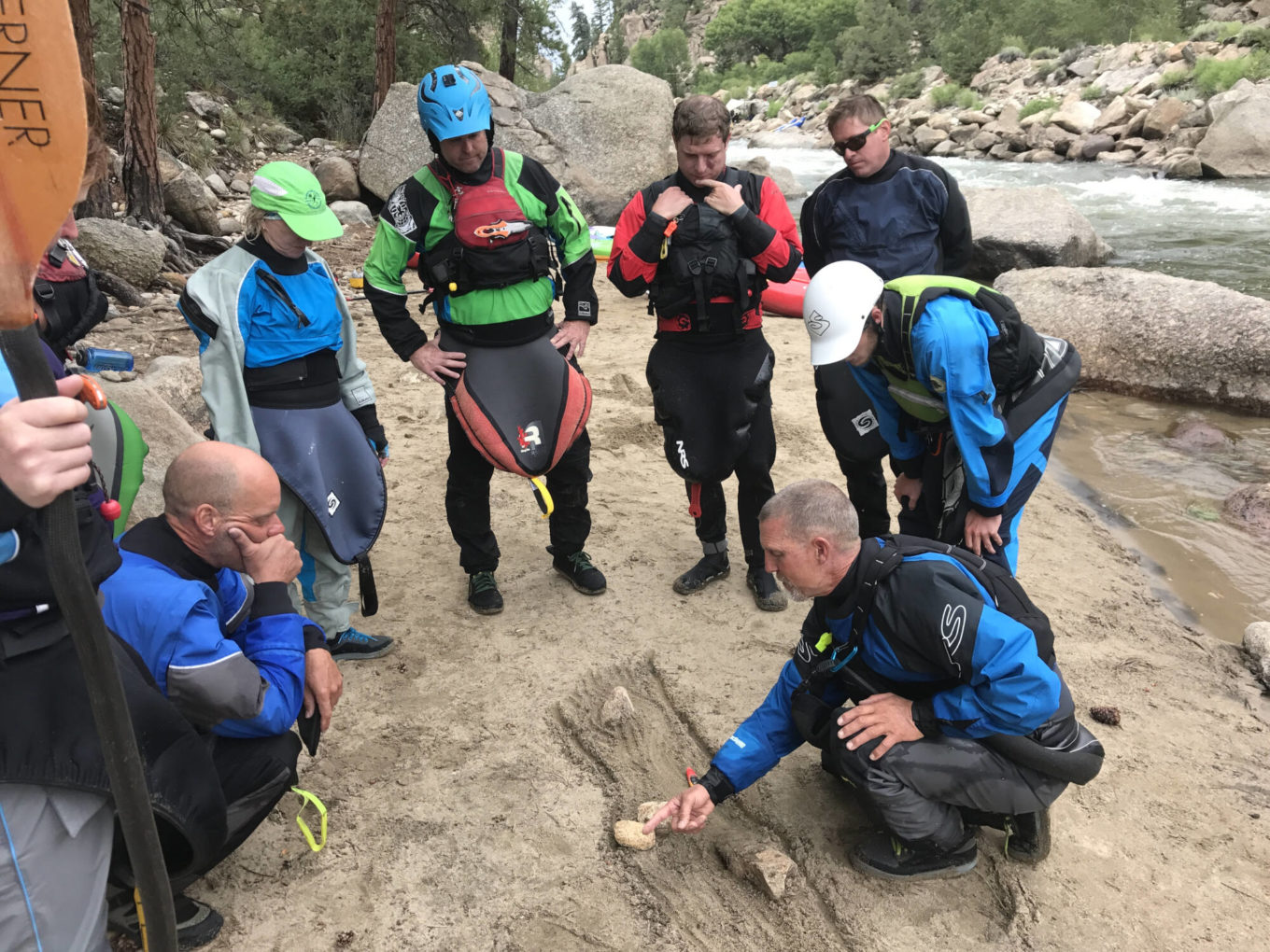 Demonstrating kayaking instruction during a rio chama kayaking trip