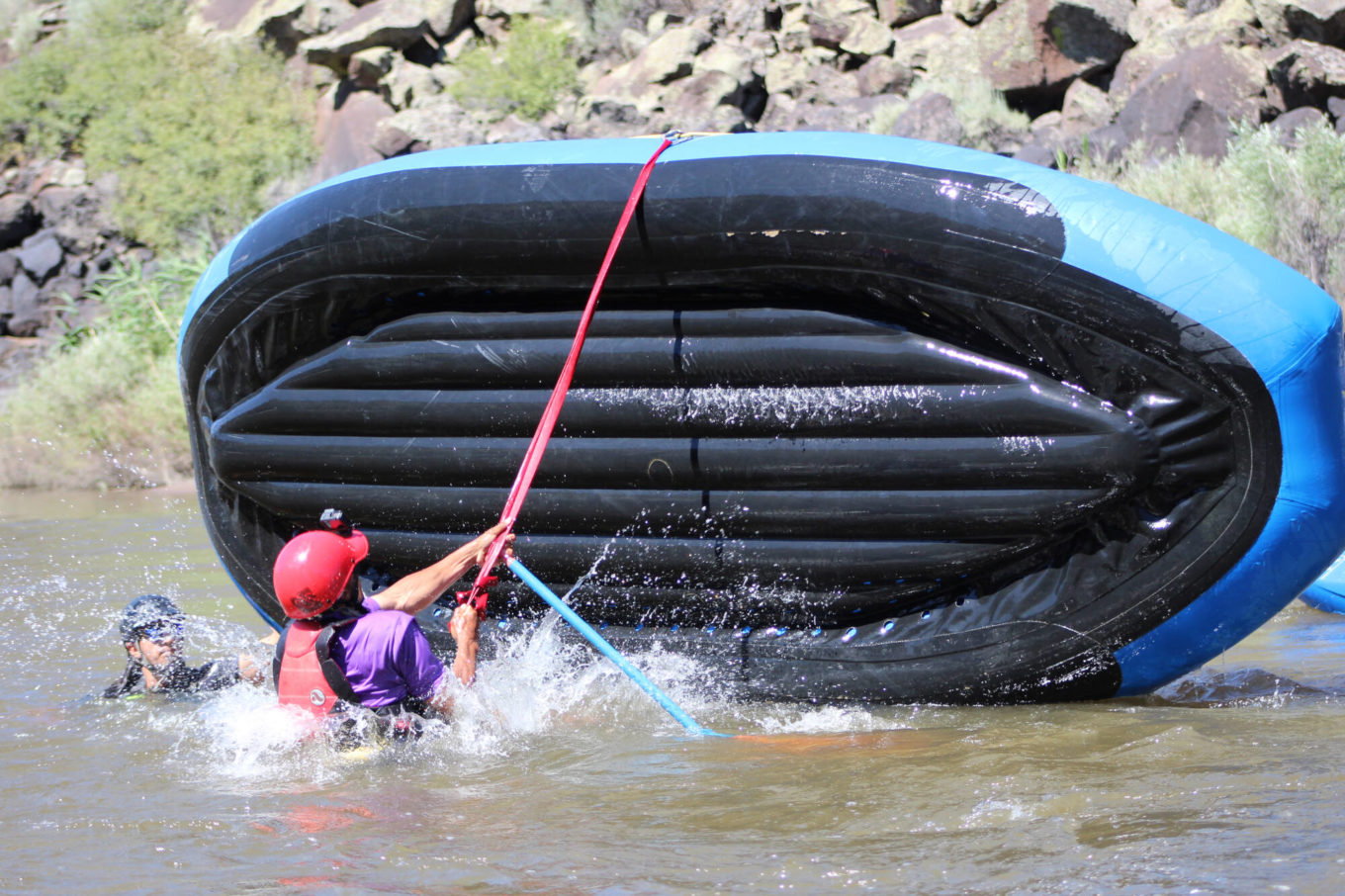 Flipping raft during the swift water rescue training course