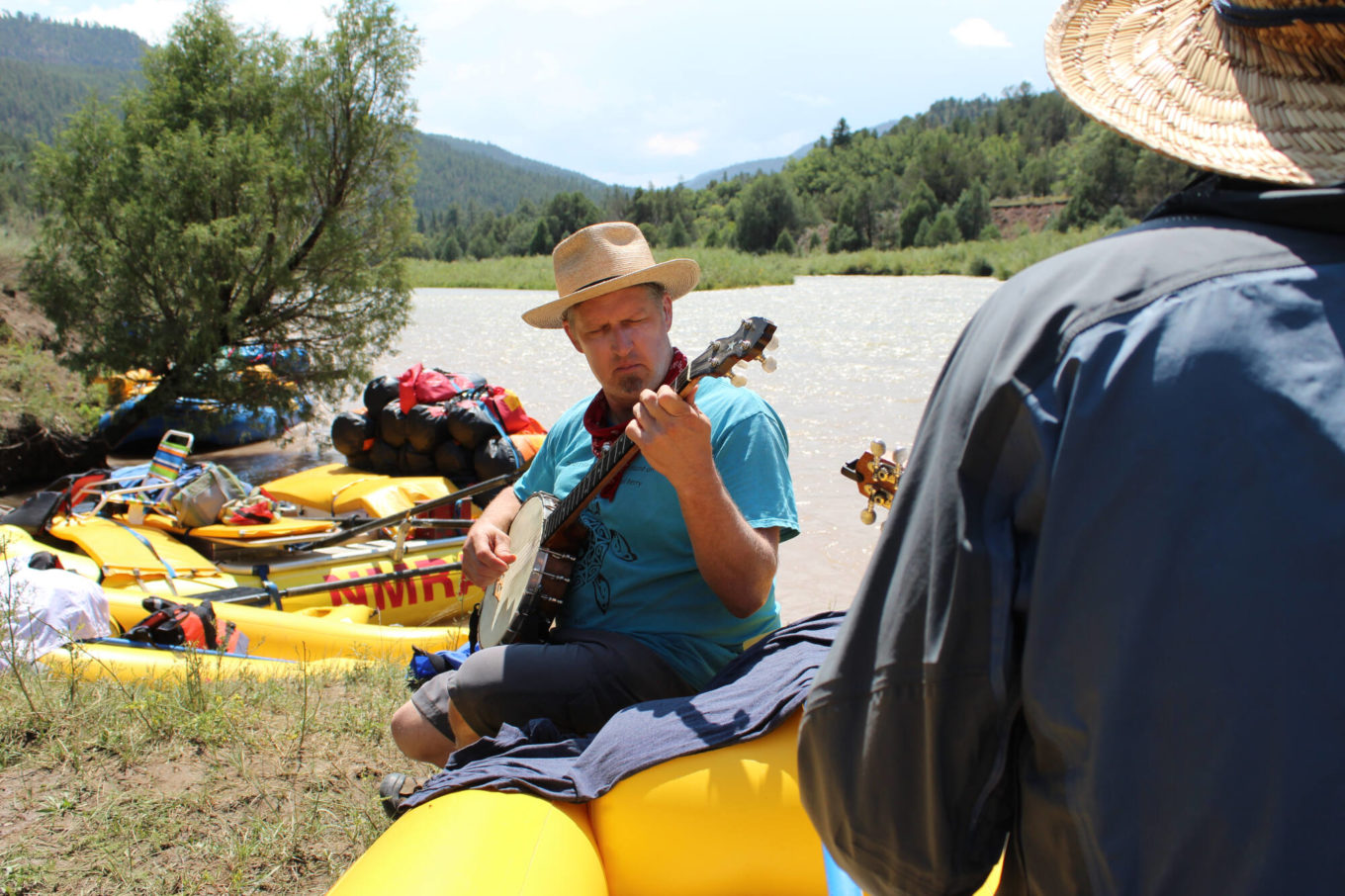Playing banjo during new mexico music trip on the river