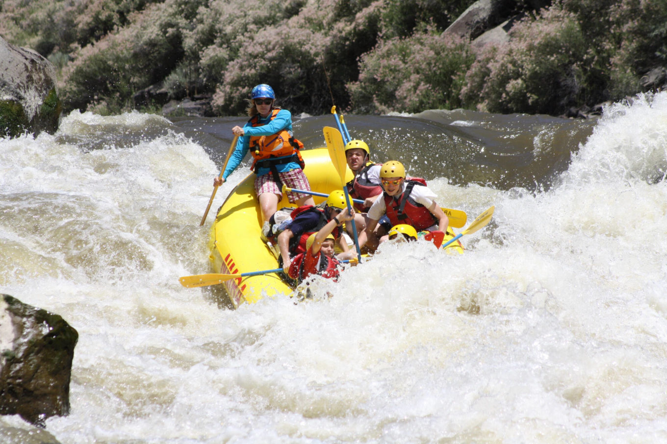 River Guide on the Taos Box rapids with family