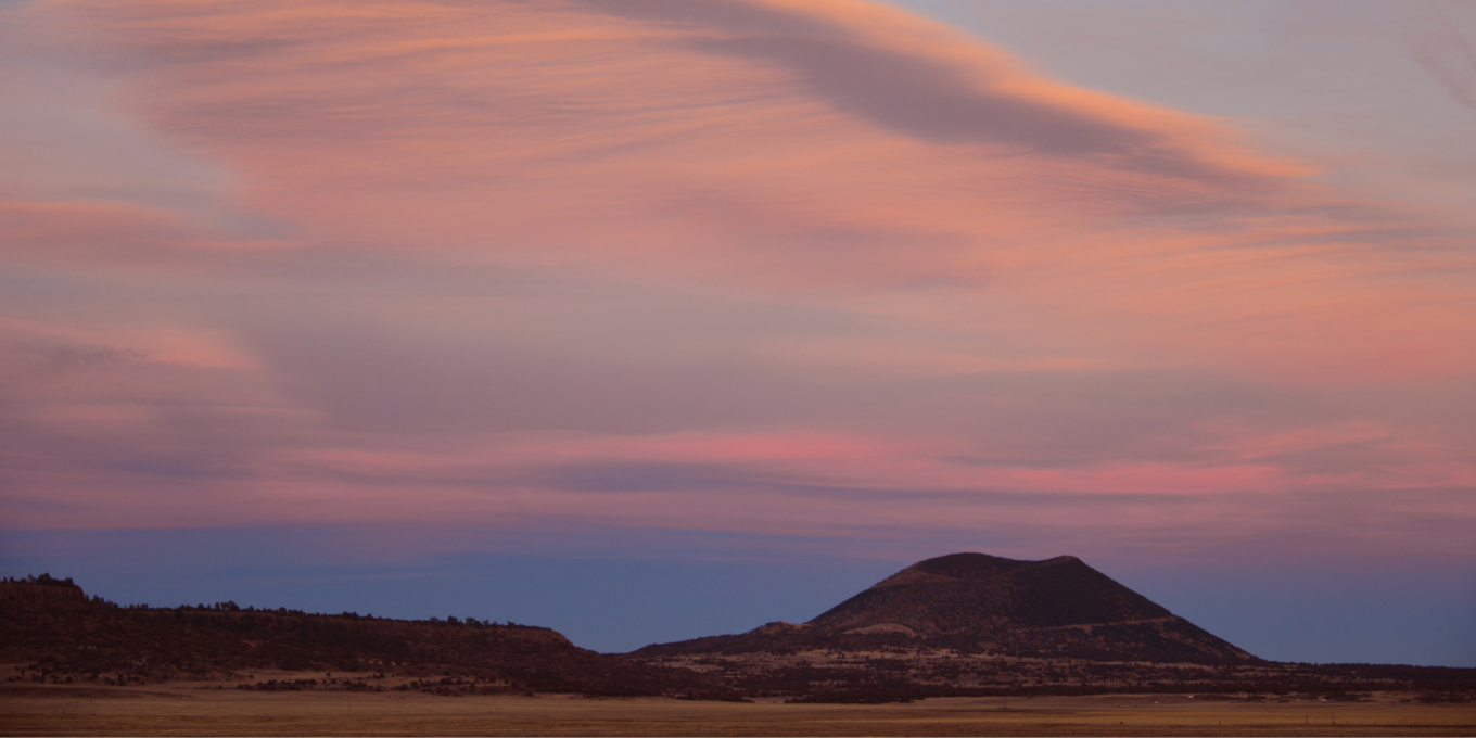 a pink sunset over Capulin Volcano
